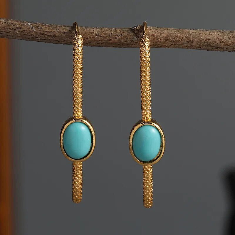 Pendientes elegantes de turquesa en oro